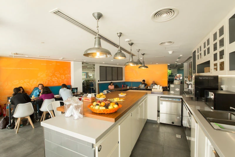 AstroLabs Coworking Space kitchen area with seating, Dubai.