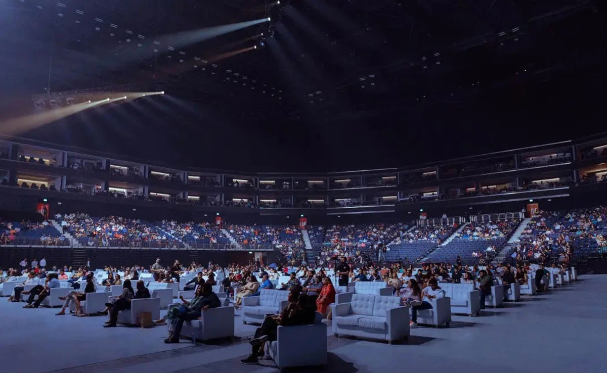 Audience seated in Coca-Cola Arena, Dubai during an event.