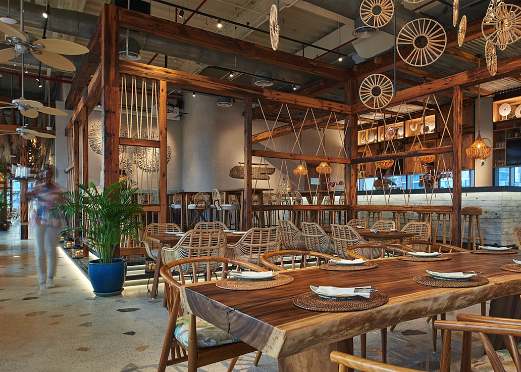Koko Bay Dubai rustic interior with wooden furniture and decor.