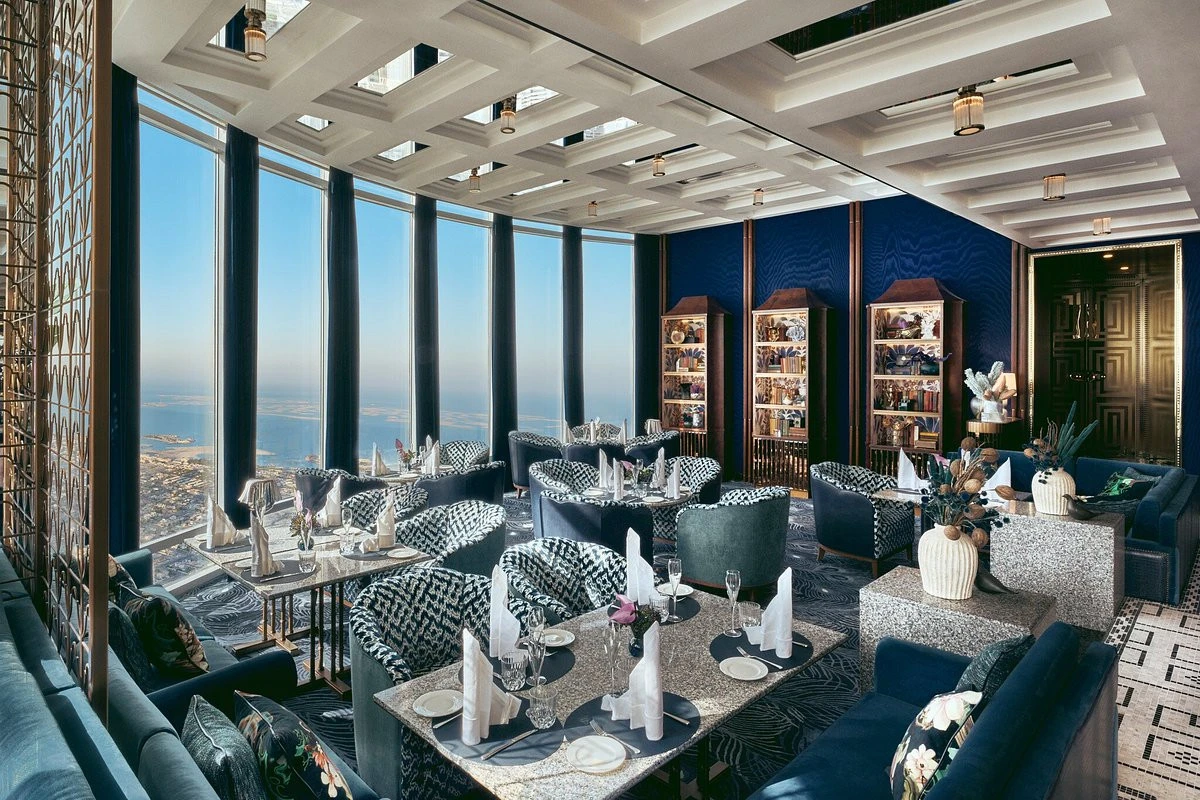Luxurious dining area at Atmosphere Burj Khalifa, overlooking Dubai skyline.