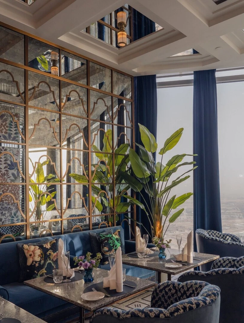 Elegant dining area at Atmosphere Burj Khalifa, Dubai with lush decor.