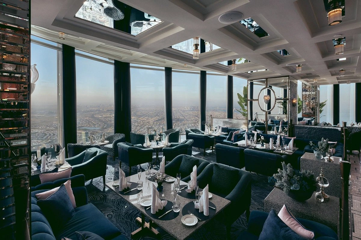 Luxurious dining at Atmosphere Burj Khalifa, overlooking Dubai skyline.