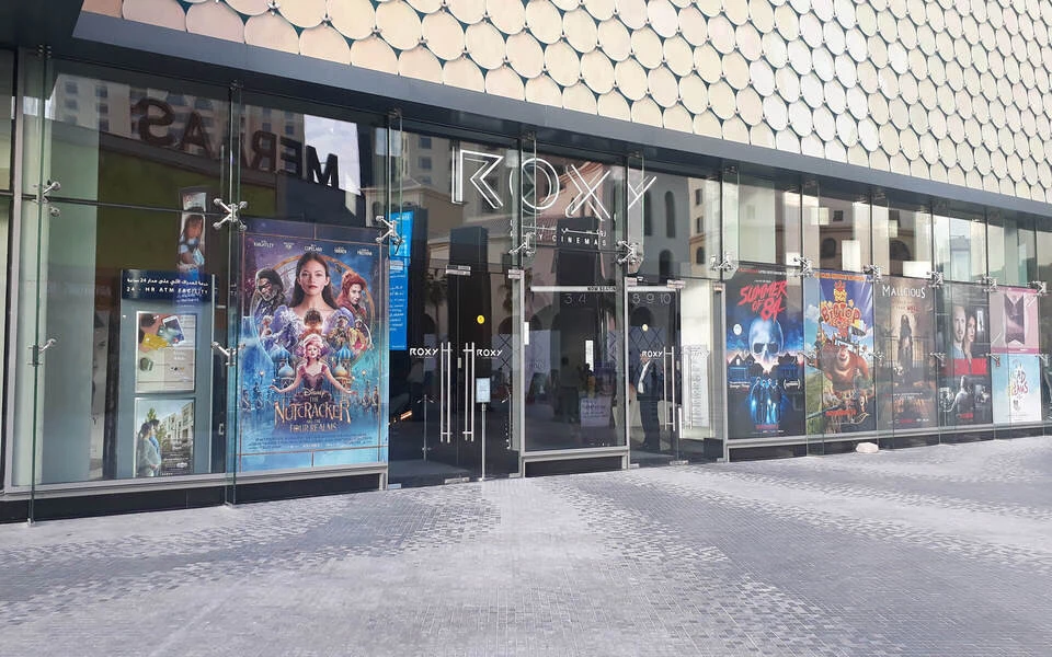 Roxy Cinema Dubai Hills entrance with movie posters displayed outside.