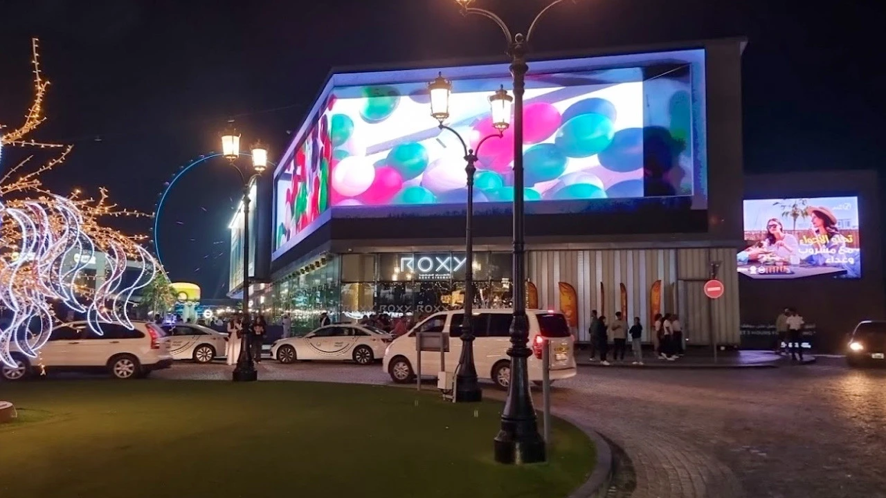 Roxy Cinema The Beach JBR illuminated at night, Dubai.