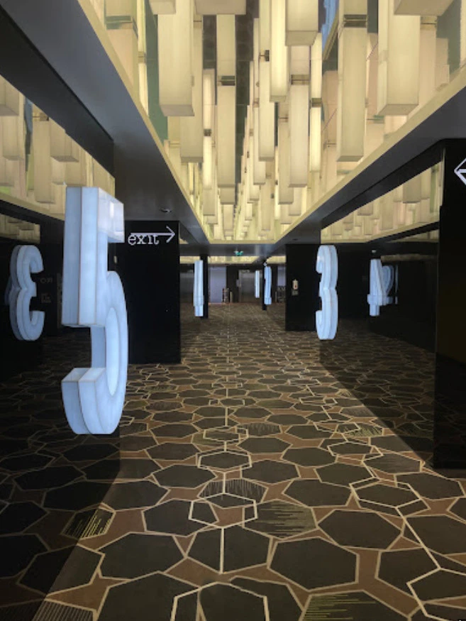 Roxy Cinema The Beach JBR hallway with illuminated numbers, Dubai.