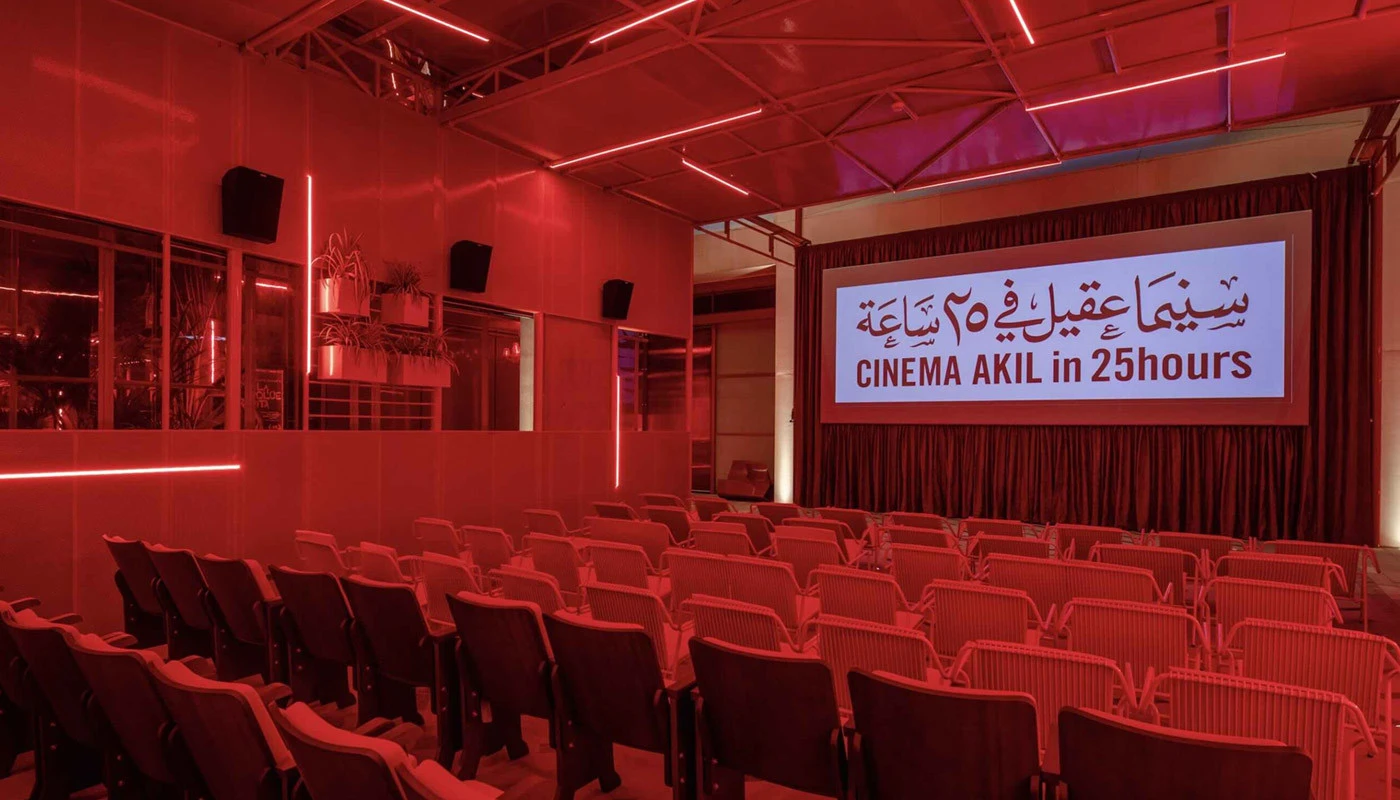 Cinema Akil auditorium with red lighting, Dubai.