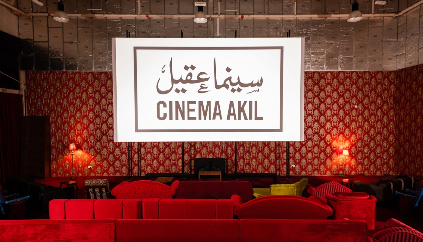 Cinema Akil interior with red seating, Dubai.