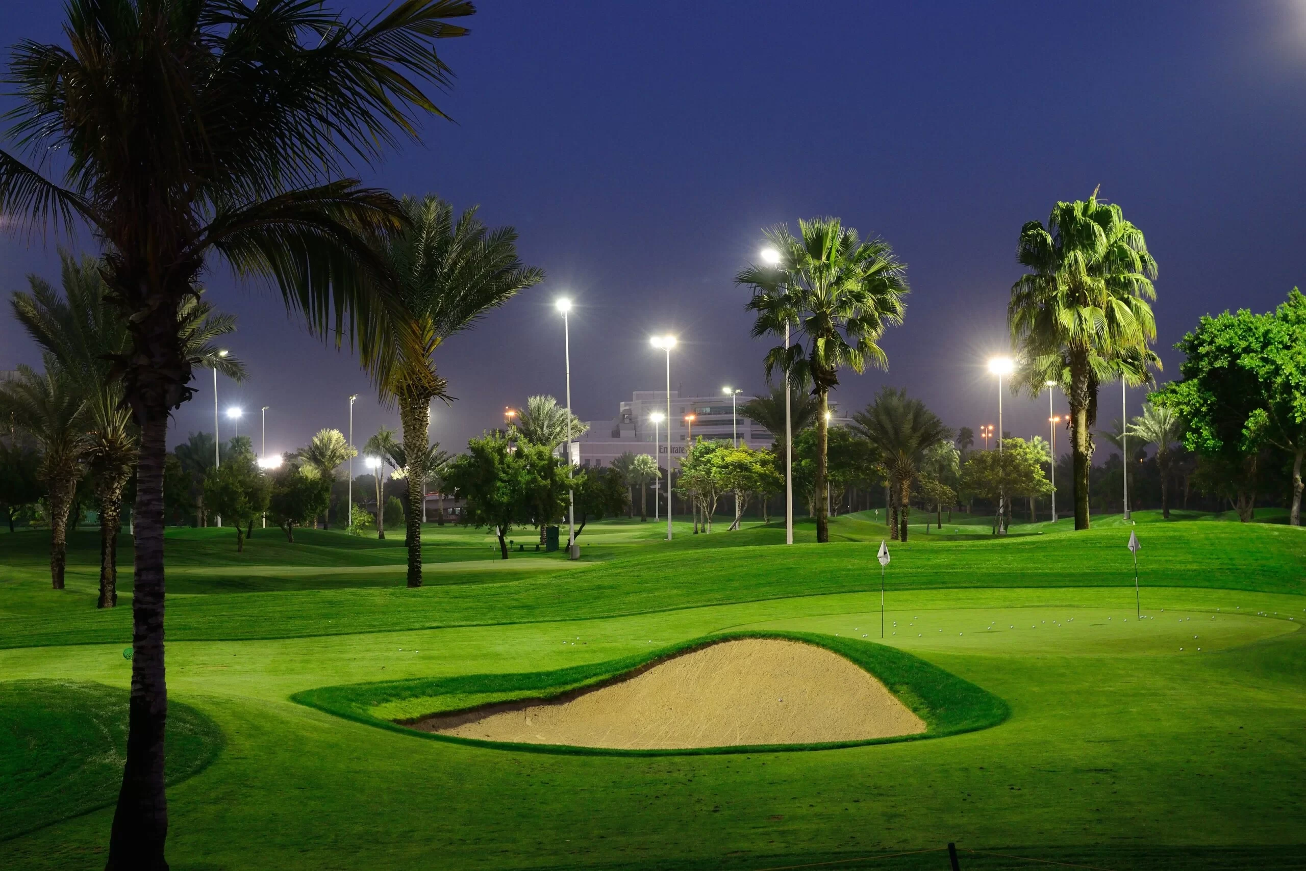 Illuminated golf course at Dubai Creek Golf & Yacht Club, Dubai.