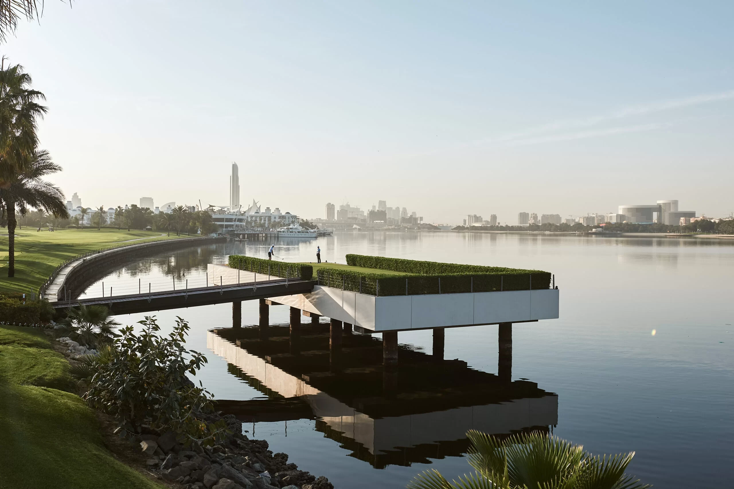 Dubai Creek Golf & Yacht Club overlooking serene water and cityscape.