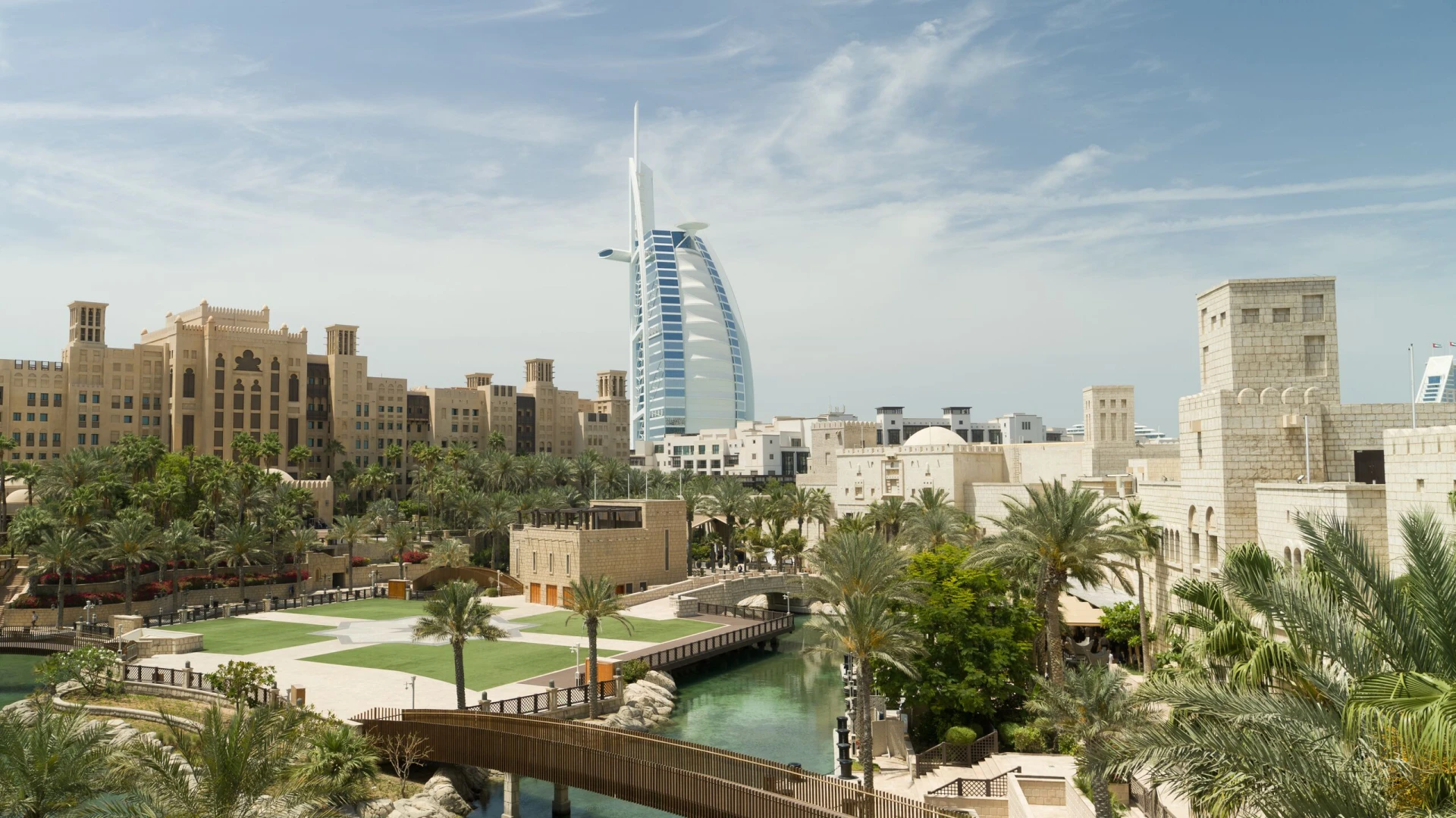 Madinat Jumeirah resort with Burj Al Arab, Dubai skyline view.