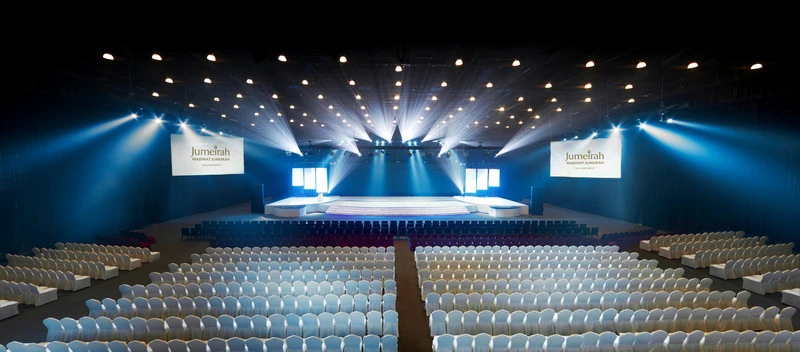 Madinat Jumeirah Arena in Dubai, spacious seating and stage setup.