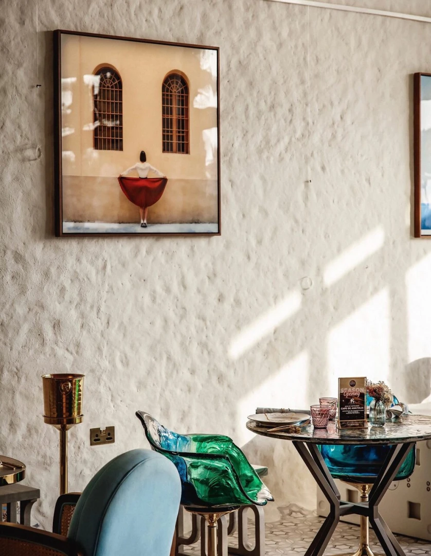 Gallery 7/40 Dubai interior with artwork and colorful seating.