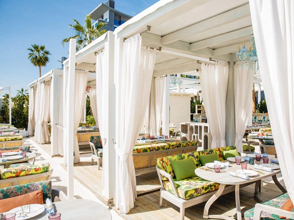 Outdoor dining area with cabanas at Gallery 7/40 Dubai.