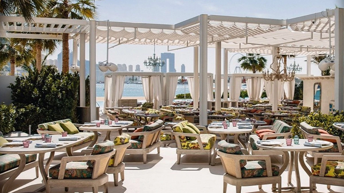 Outdoor seating at Gallery 7/40 Dubai with waterfront view.
