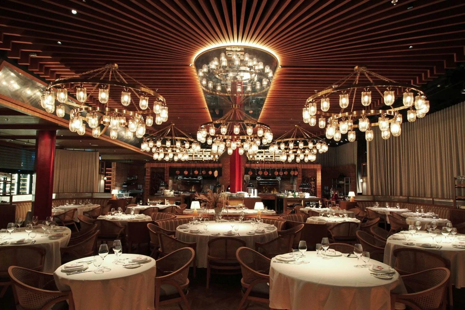 Elegant dining area with chandeliers at The Guild Dubai.