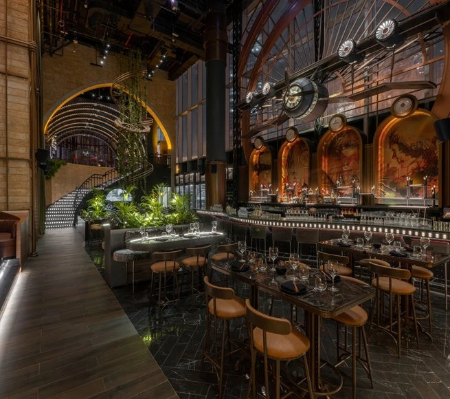 Amelia Lounge with lush plants and stylish seating, Dubai.