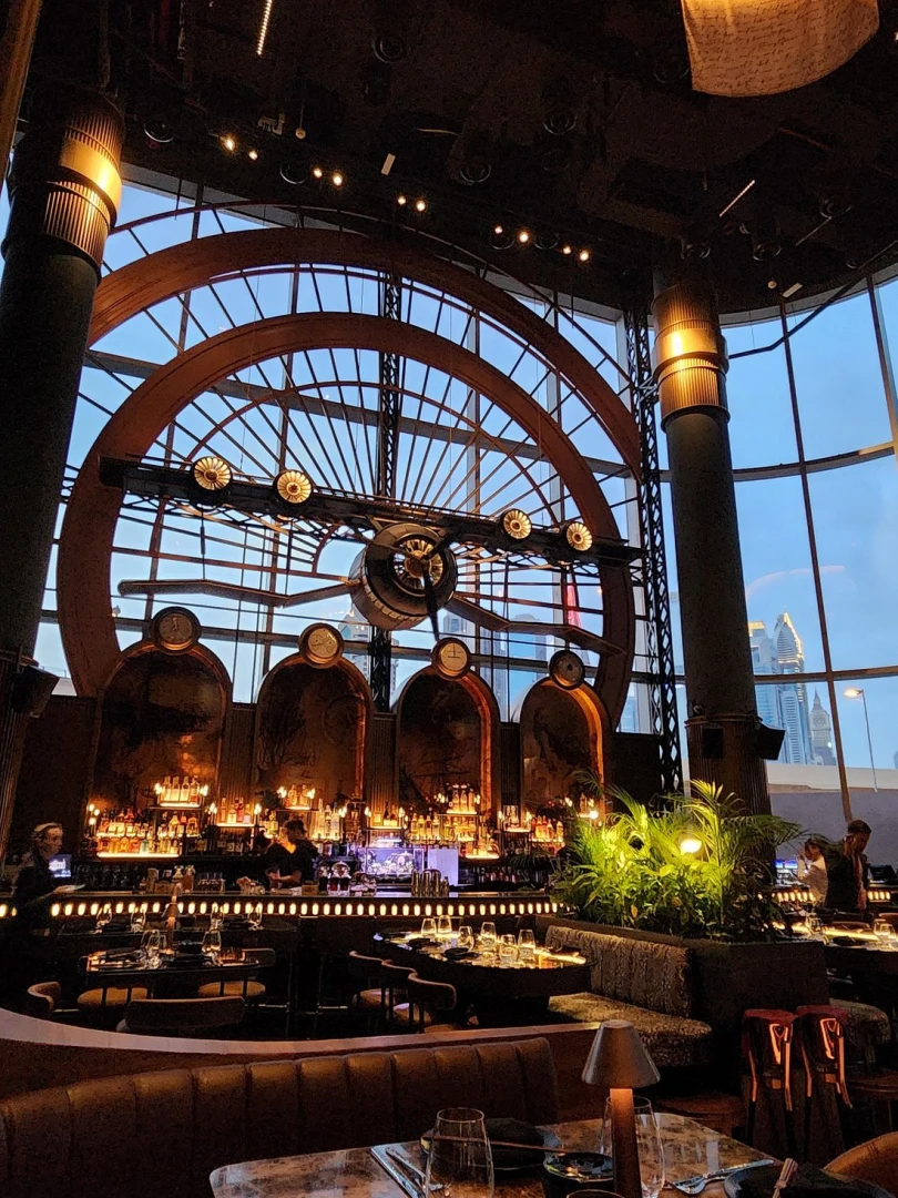 Amelia Restaurant & Lounge interior with large clock, Dubai.