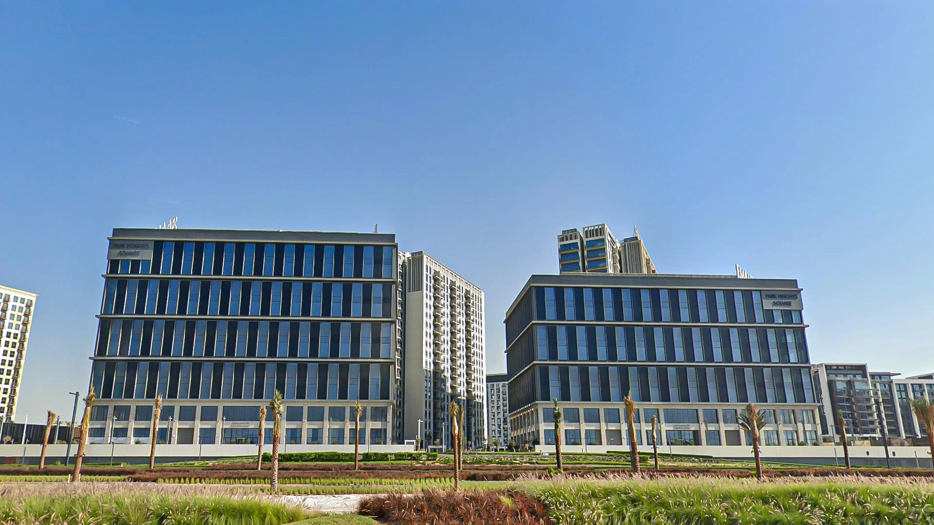 LUMA Studio exterior with modern architecture, Dubai skyline backdrop.