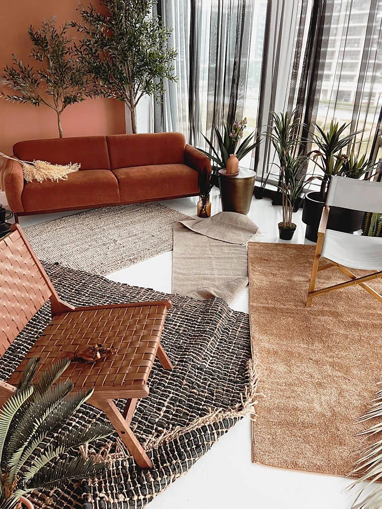 Cozy seating area with plants at LUMA Studio, Dubai.