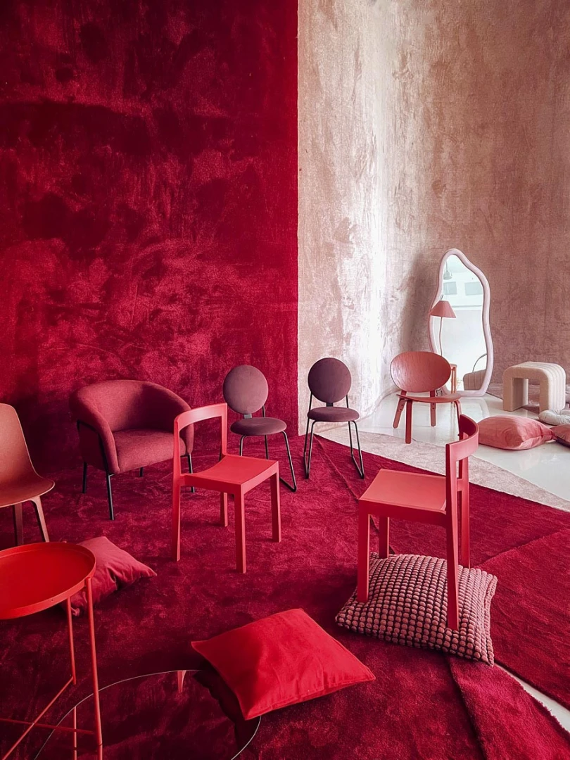 Red-themed seating area at LUMA Studio, Dubai.