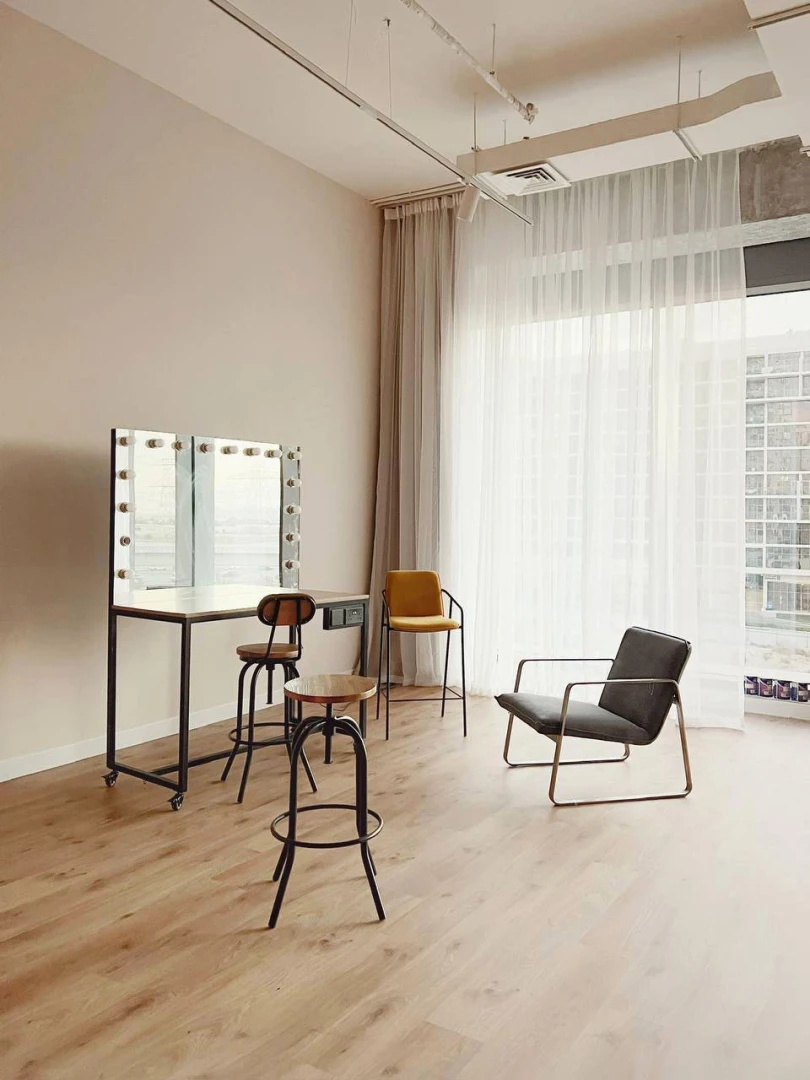 Modern studio with chairs and vanity mirror, LUMA Studio, Dubai.