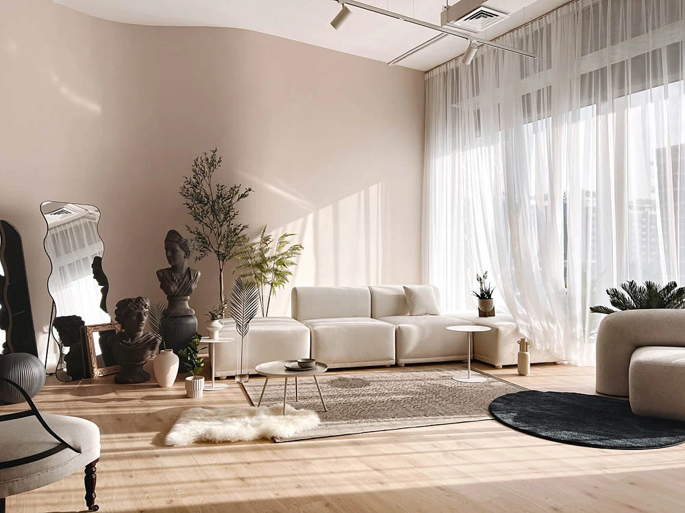 LUMA Studio Dubai, elegant lounge with sculptures and modern furniture.