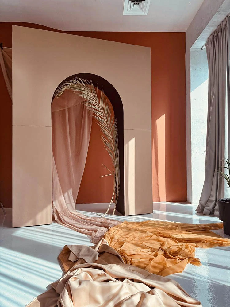 Elegant archway with draped fabric at LUMA Studio, Dubai.
