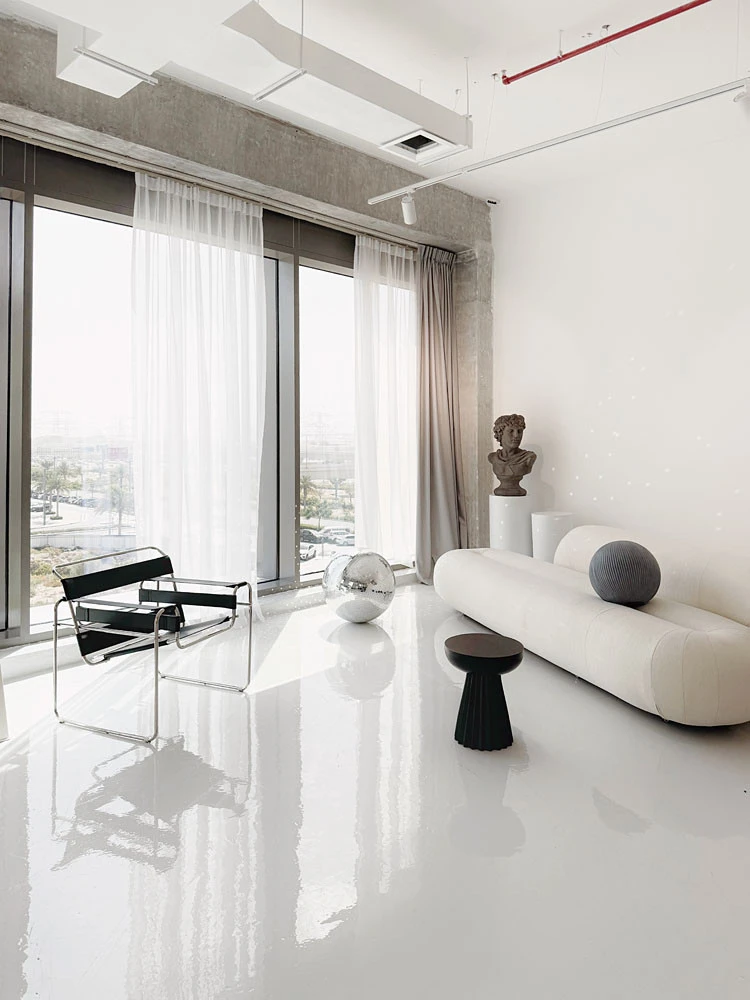 Minimalist LUMA Studio interior with modern furniture, Dubai.