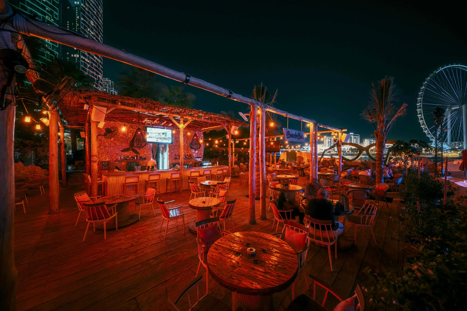 Outdoor seating at Bla Bla Dubai with city skyline view.