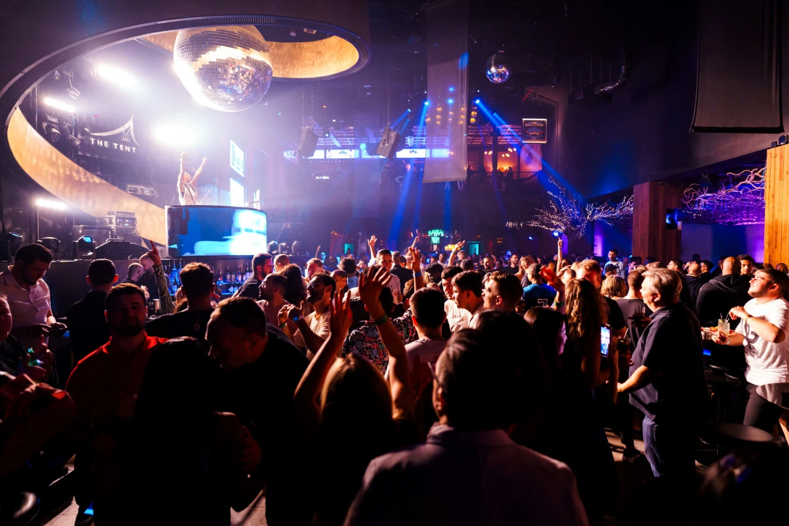 Crowded nightclub scene at Bla Bla Dubai with vibrant lighting.