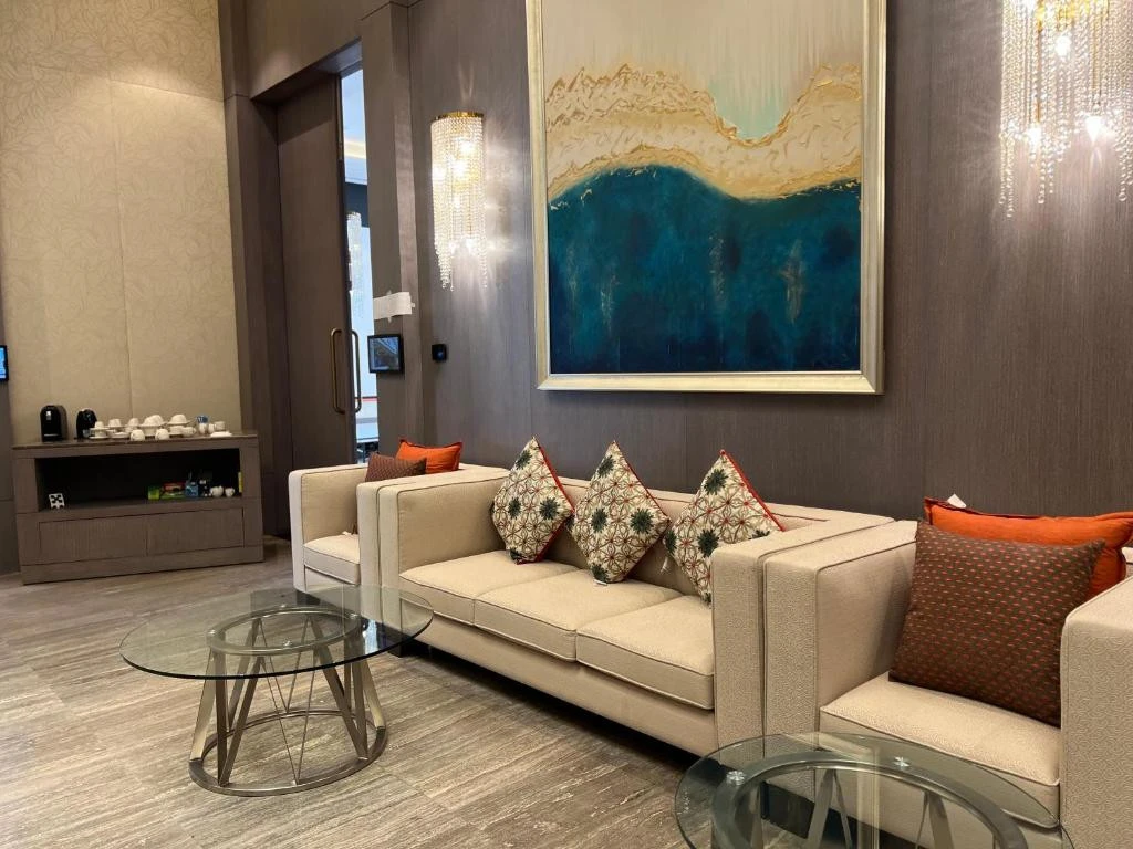 Elegant lounge at Khalidia Palace Hotel Dubai with modern decor.