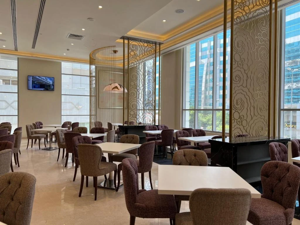 Chic dining space with patterned dividers at Khalidia Palace Hotel, Dubai.