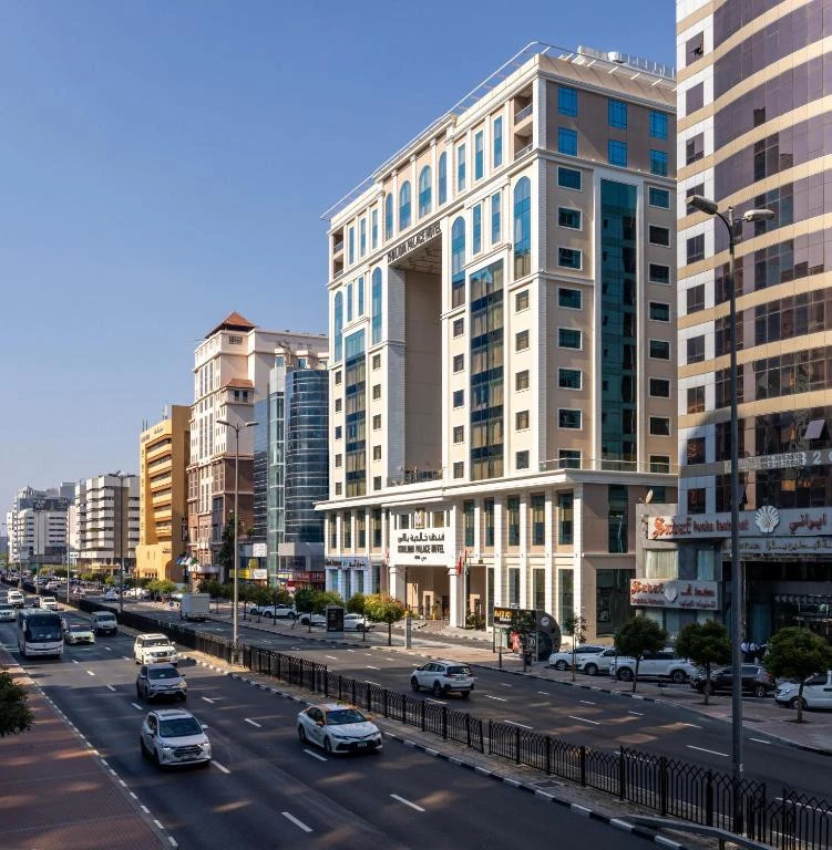 Khalidia Palace Hotel Dubai facade with busy street view.