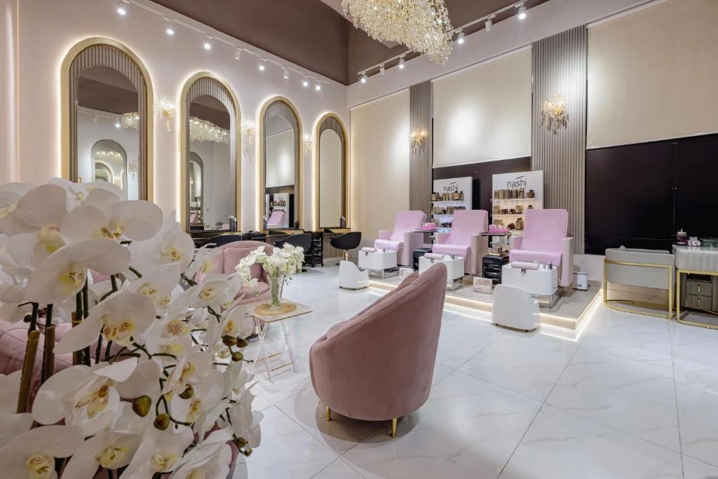 Elegant salon interior at Khalidia Palace Hotel Dubai with pink seating.