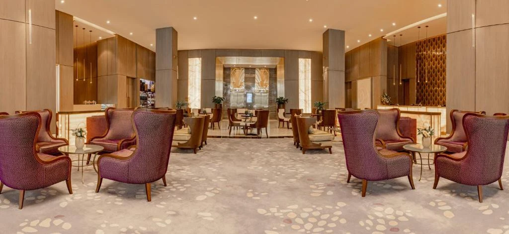 Elegant lounge area at Khalidia Palace Hotel Dubai with plush seating.
