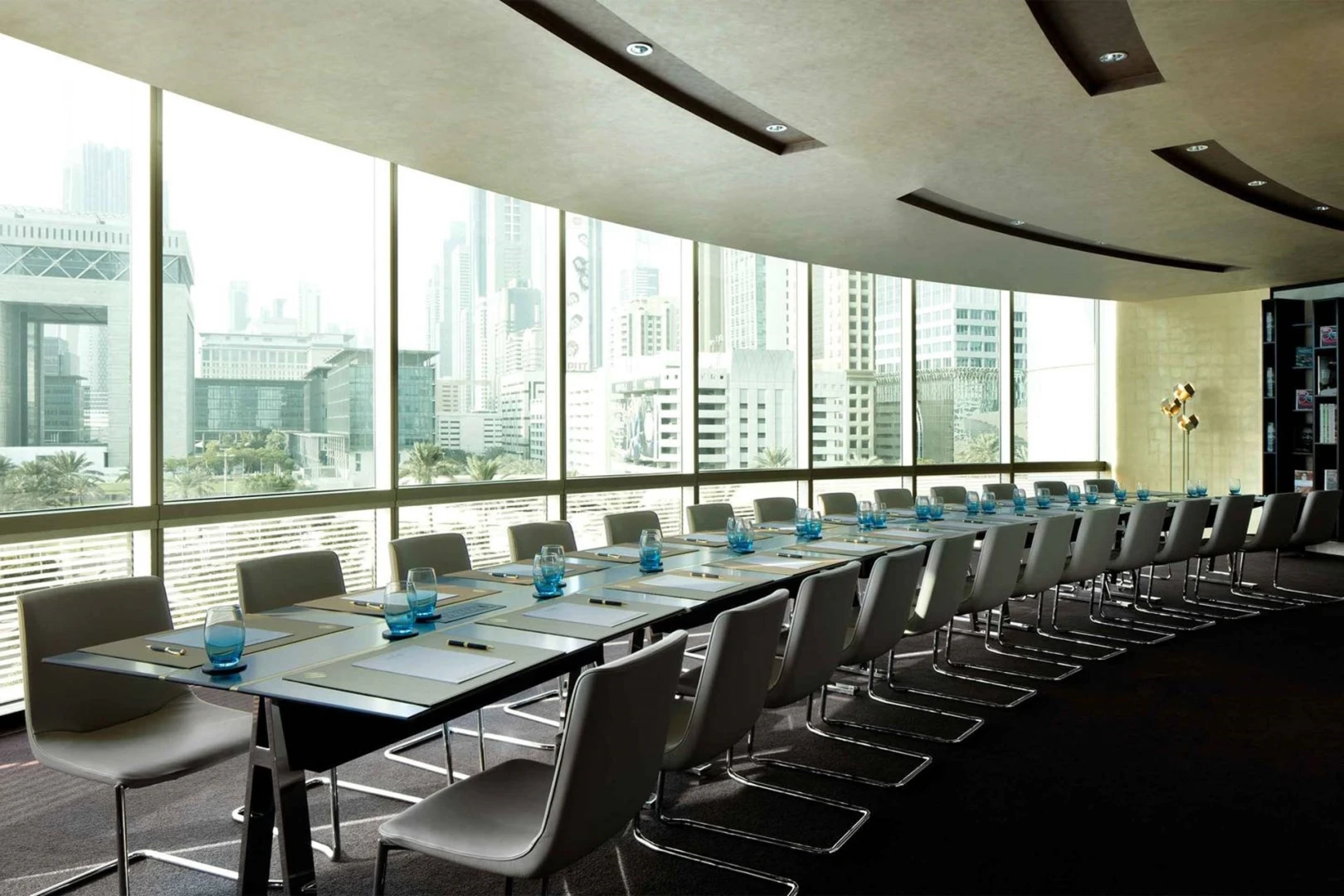 Spacious conference room with Dubai skyline, Jumeirah Emirates Towers.
