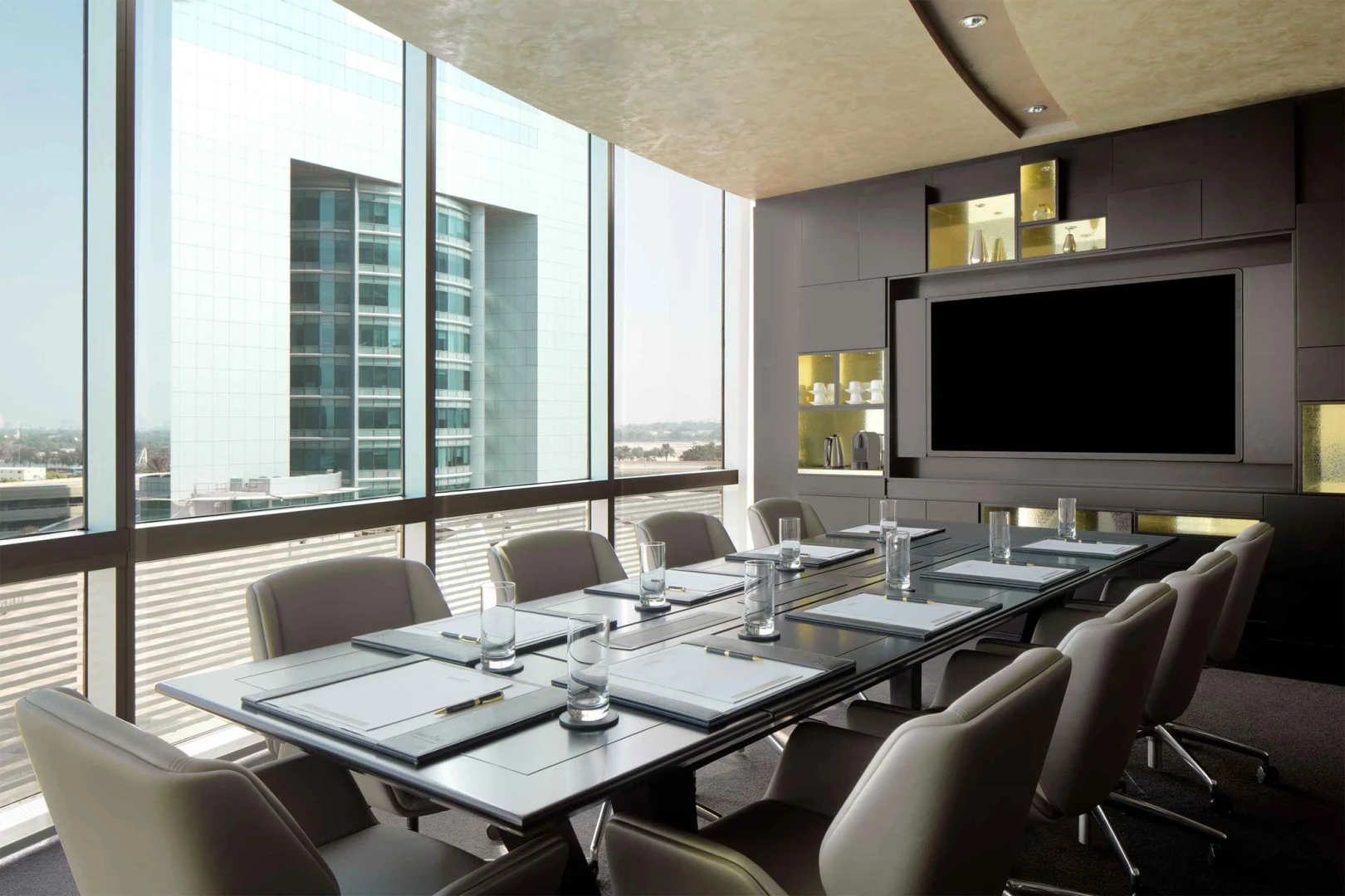Modern conference room at Jumeirah Emirates Towers, Dubai with city view.