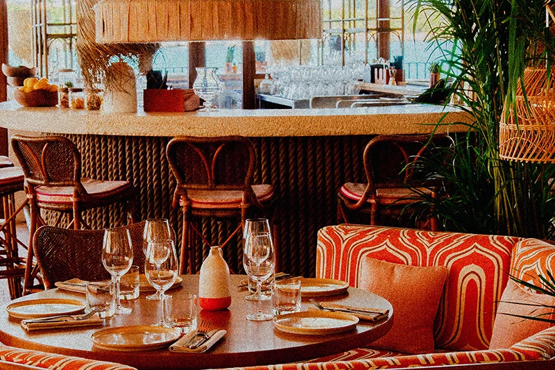 Cozy dining area at Tagomago Dubai with elegant table setting.