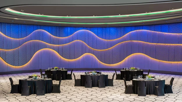 Elegant ballroom with wave-patterned walls at W Dubai - The Palm.