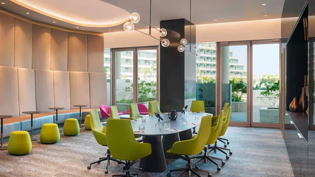 Contemporary conference room with colorful chairs at W Dubai - The Palm.