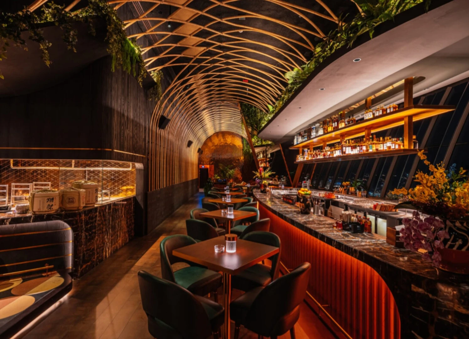 Elegant interior of Sushisamba Dubai with bar and dining tables.