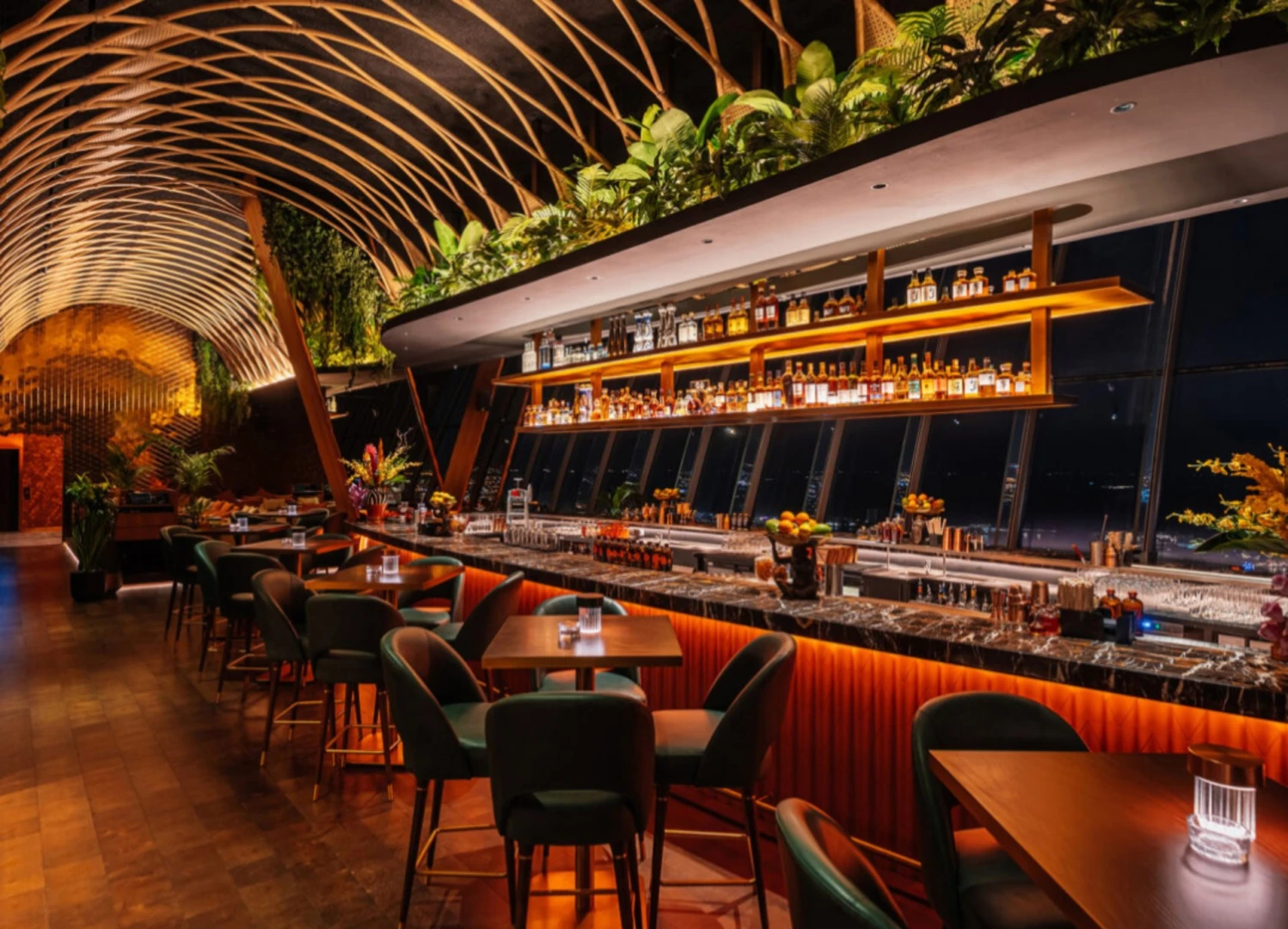 Elegant bar interior at Sushisamba Dubai with lush greenery.