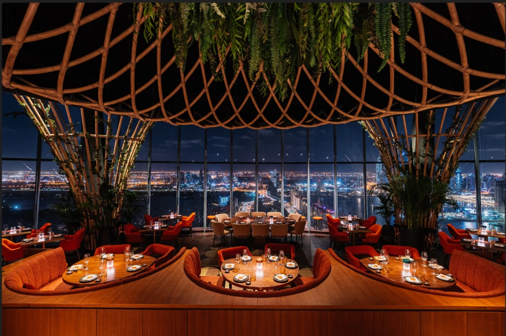 Sushisamba Dubai interior with city skyline view at night.