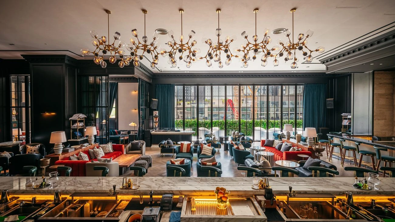 Elegant interior of Chic Nonna Dubai with modern chandeliers and seating.