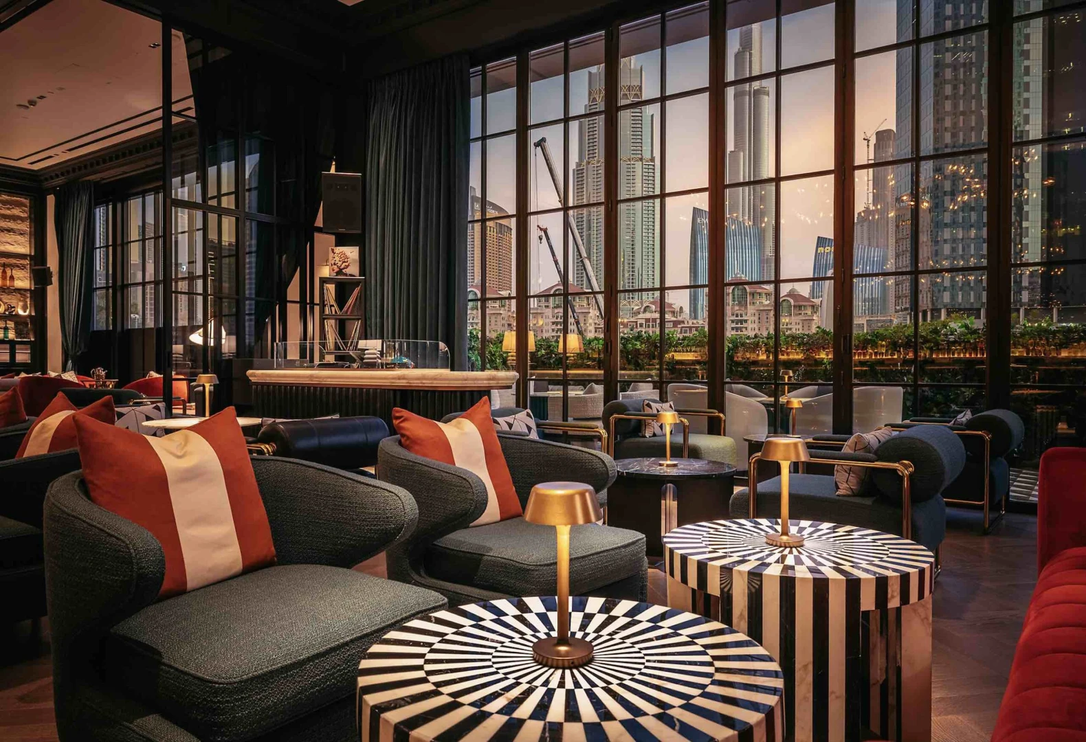 Elegant seating area at Chic Nonna Dubai with city skyline view.