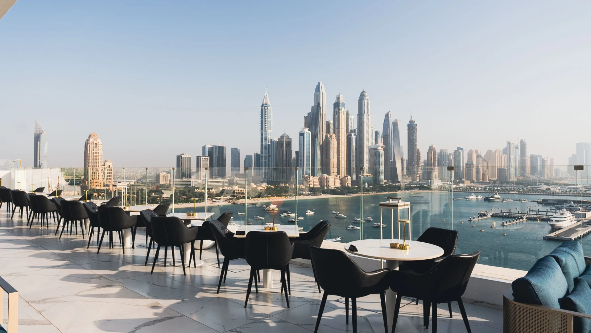 The Penthouse Dubai rooftop lounge with city skyline view.