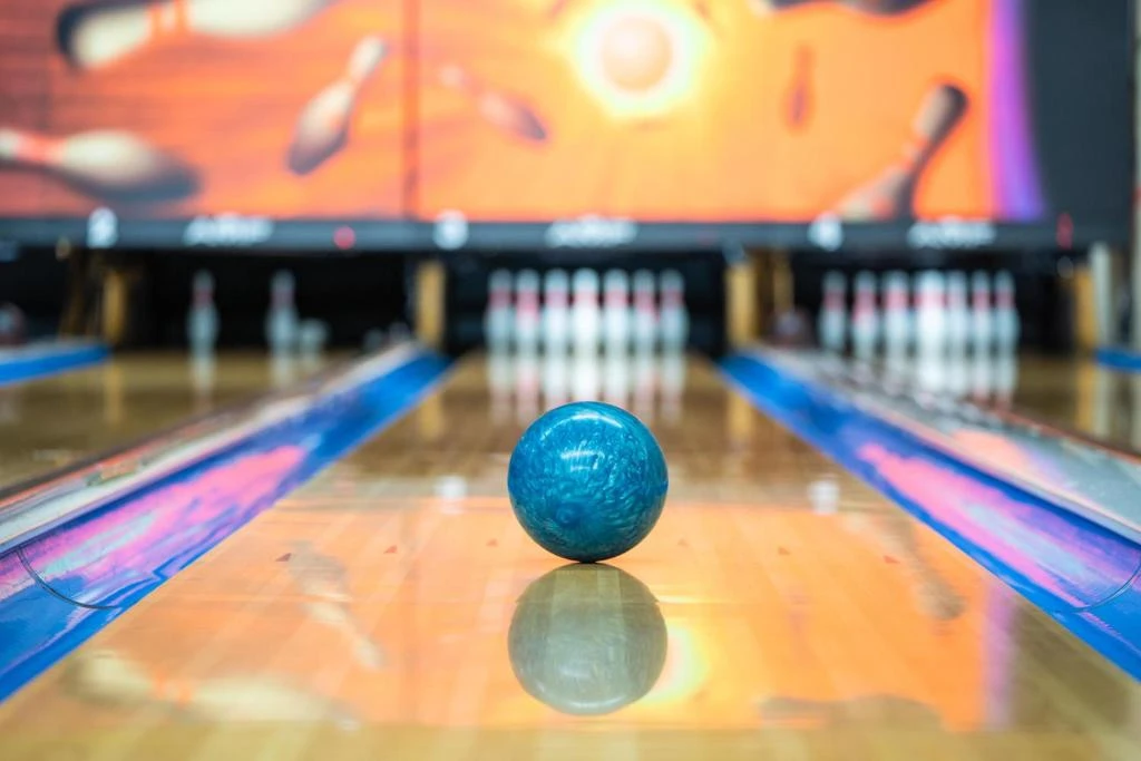 Bowling alley with blue ball at Erth Hotel Abu Dhabi.