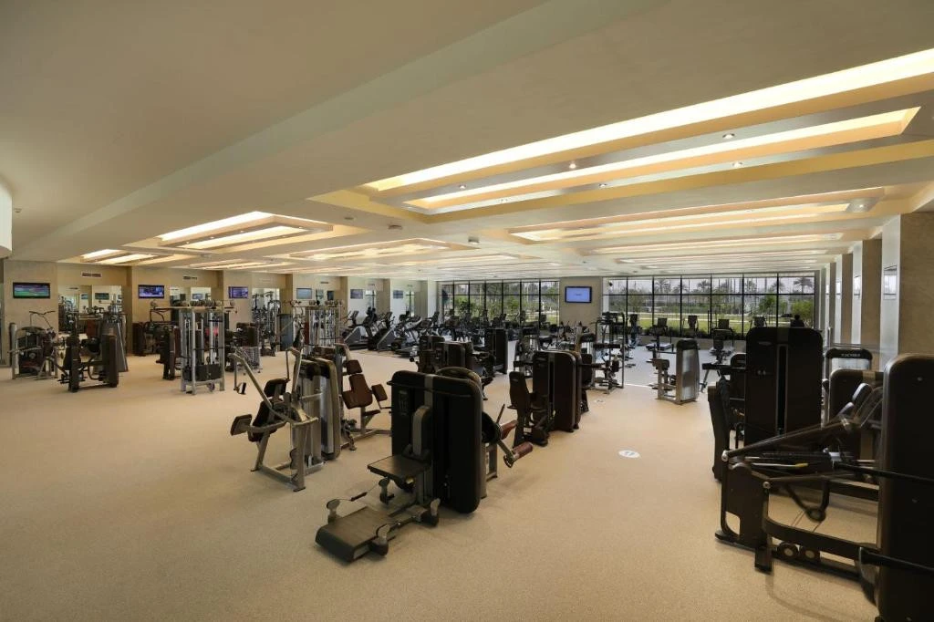 Spacious gym with modern equipment at Erth Hotel Abu Dhabi.