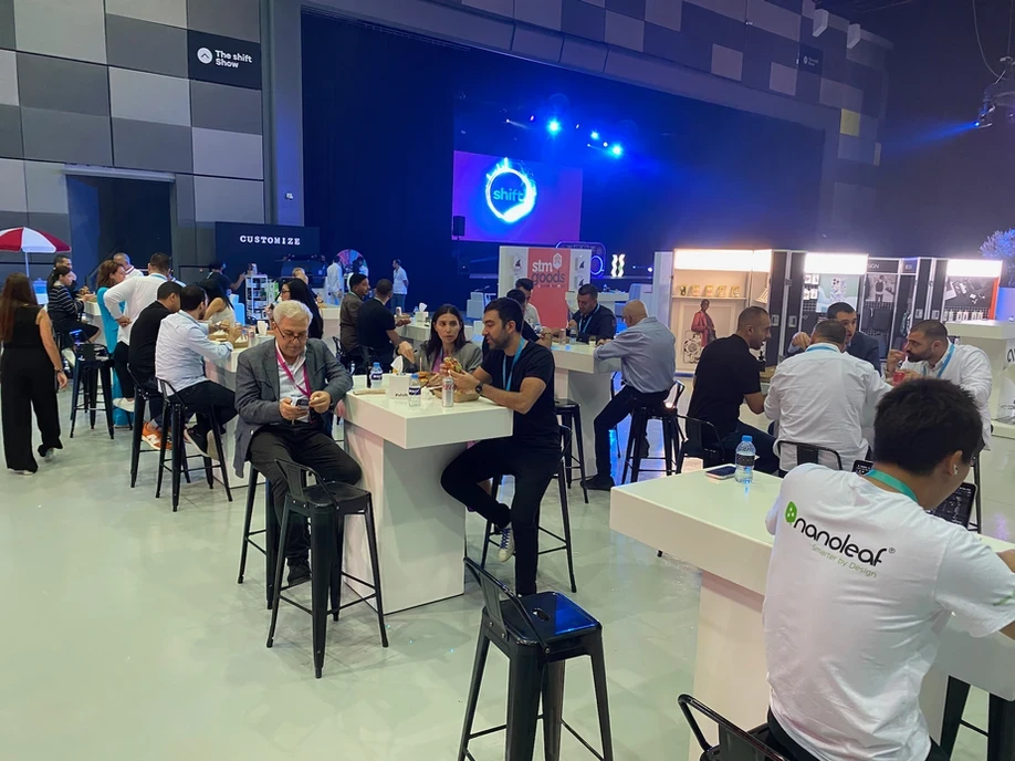 People socializing at The Agenda venue in Dubai.