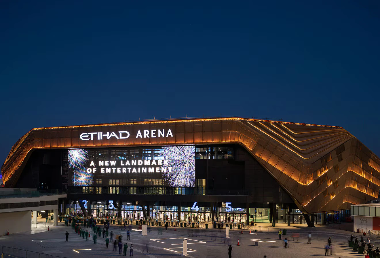 Etihad Arena illuminated at night, Abu Dhabi.
